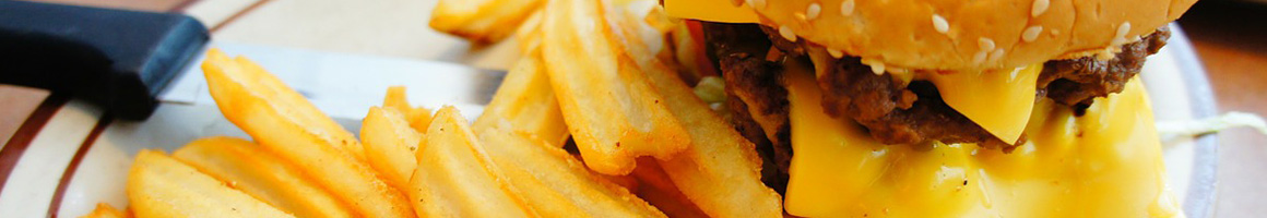 Eating Burger at Ty's Burger House restaurant in Oceanside, CA.